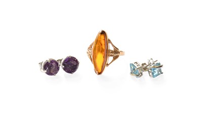 Lot 431 - An Amber Ring, the marquise cabochon in a...