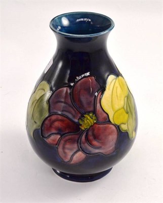 Lot 383 - A Walter Moorcroft Clematis pattern vase, impressed factory marks, 22cm high