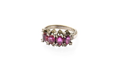 Lot 443 - A Red Stone and Diamond Cluster Ring, four...