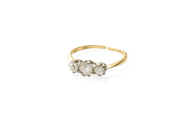 Lot 512 - A Diamond Three Stone Ring, the graduated old...