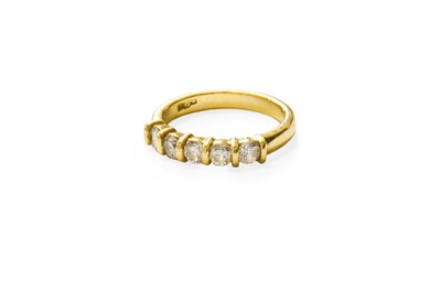 Lot 472 - An 18 Carat Gold Diamond Five stone Ring, the...