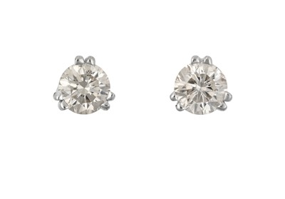 Lot 2310 - A Pair of Diamond Solitaire Earrings the round...