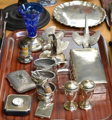 Lot 393 - A collection of silver including a pair of pepperettes, pair of salts, cigarette box, toast...