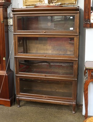 Lot 1477 - An Oak Globe Wernicke Four Tier Stacking...