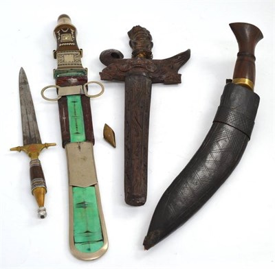 Lot 394 - Nigerian silver mounted dagger, a Malayan Kris, a Kukri and an Indian dagger