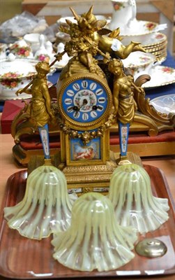 Lot 395 - A 19th century French gilt bronze mantel clock with porcelain dial and columns, also three Vaseline