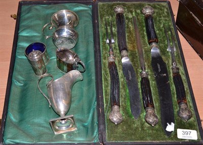 Lot 397 - A set of antler horn carvers in case, silver jug, mug and three condiments