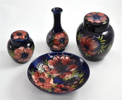 Lot 401 - Four pieces of Moorcroft Anemone pattern: bowl, 18.5cm wide, two ginger jars and covers, 16cm...