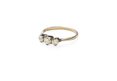 Lot 471 - A Diamond Three Stone Ring, the graduated old...