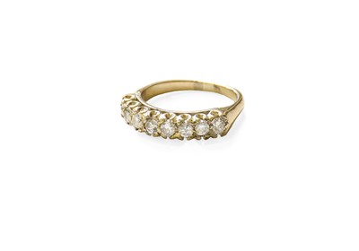 Lot 483 - A Diamond Half Hoop Ring, eight round...