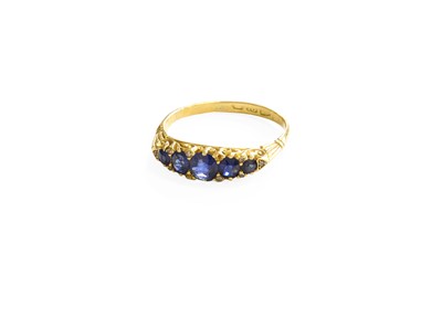 Lot 122 - An 18 Carat Gold Sapphire Five Stone Ring, the...