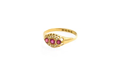 Lot 121 - An 18 Carat Gold Ruby and Diamond Ring, three...