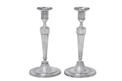 Lot 2016 - A Pair of George III Silver Candlesticks