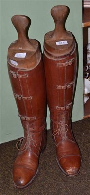 Lot 437 - A pair of leather riding boots with wooden trees