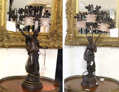 Lot 1451 - A Bronzed Composite Figural Three-Light Table...