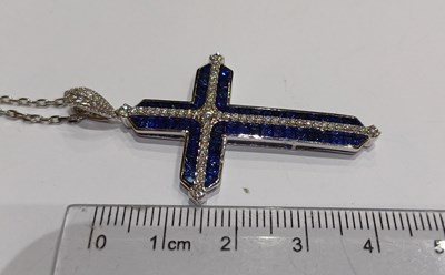 Lot 2232 - A Sapphire and Diamond Cross Pendant on Chain...
