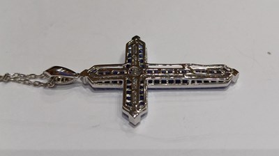 Lot 2232 - A Sapphire and Diamond Cross Pendant on Chain...