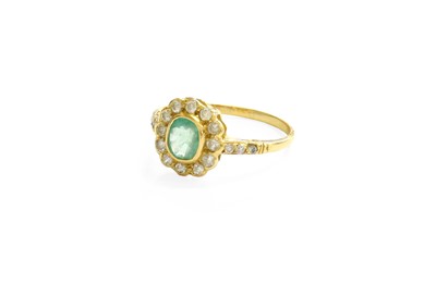 Lot 27 - An Emerald and Diamond Cluster Ring, the oval...