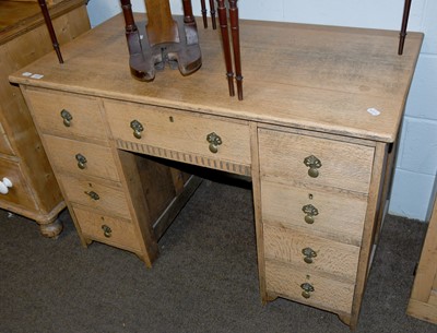 Lot 1572 - A Light Oak Kneehole Desk, early 20th century...