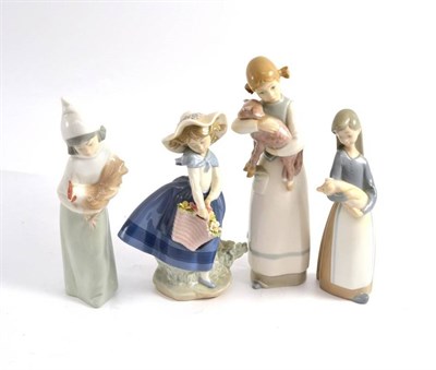 Lot 506 - Four Lladro figures of children