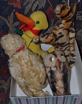 Lot 516 - A plush cat, owl, Tigger and felt duck