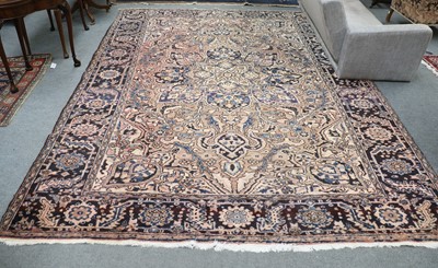 Lot 1134 - Heriz Carpet, the field with a large...