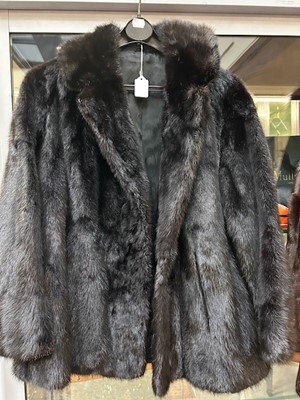 Lot 1118b - A Black Short Mink Jacket, with vents to the...