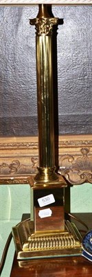 Lot 530 - A brass Corinthian column table lamp with shade