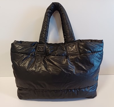 Lot A Chanel Padded Coco Cocoon Tote Bag in black...