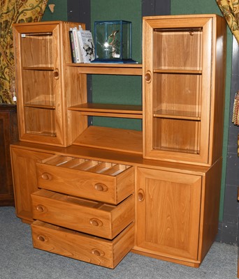 Lot 1337 - A Ercol Light Elm Display Cupboard, 155cm by...