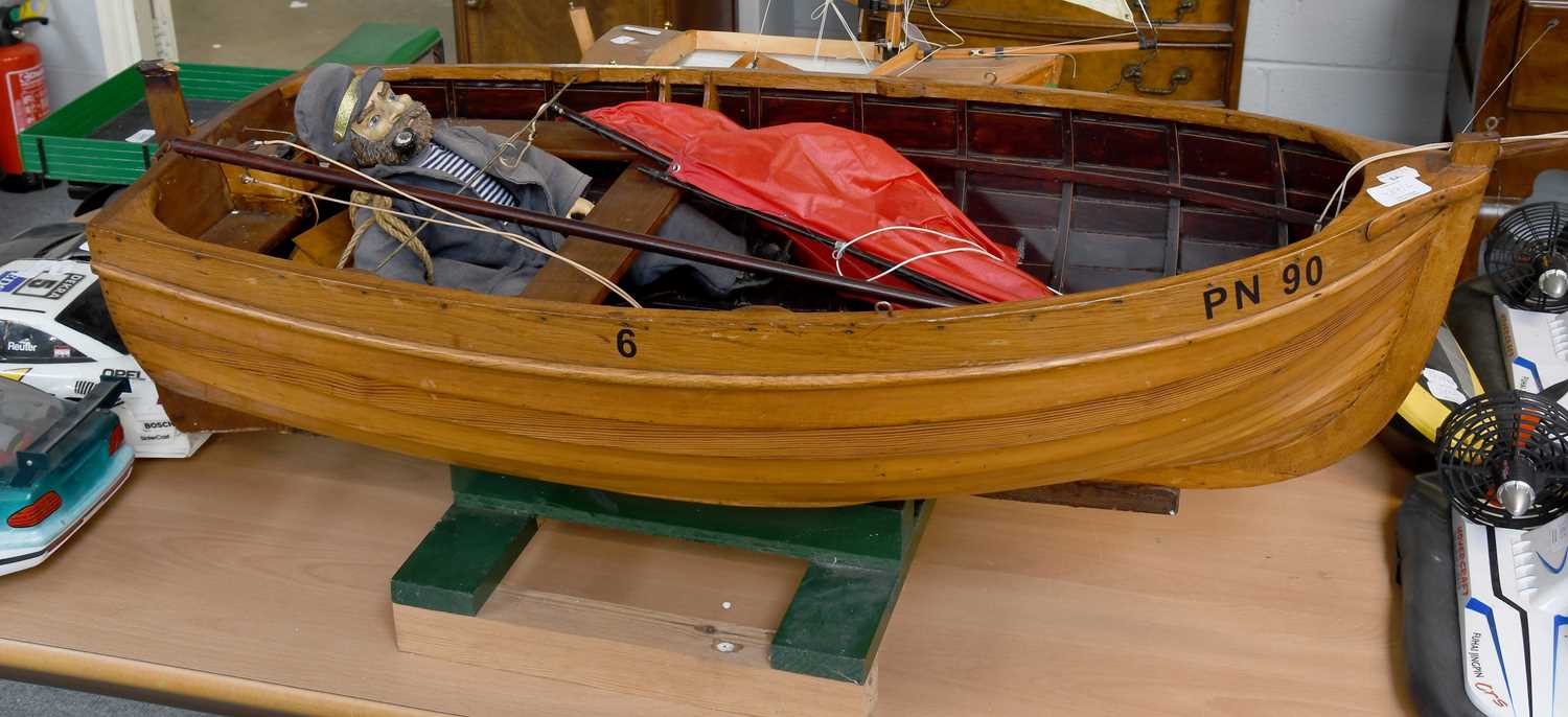 Lot 387 - Model clinker built small sailing boat PN90
