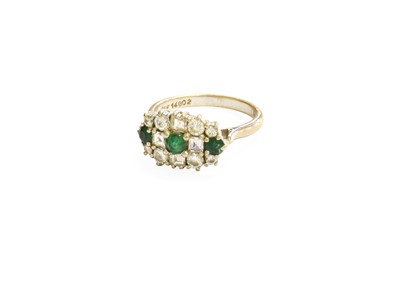 Lot 86 - An 18 Carat White Gold Emerald and Diamond...