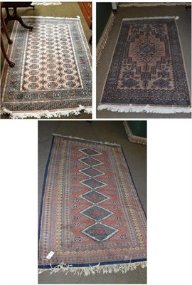 Lot 676 - Lahore 'Bukhara' Rug, Punjab, the field with three rows of quartered guls within sunburst...