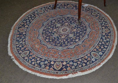 Lot 678 - An unusual circular rug, probably Tabriz, Persian Azerbaijan, the mid blue medallion of...