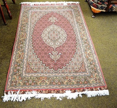 Lot 681 - A Tabriz silk 'fish' rug