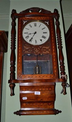 Lot 688 - A Victorian walnut drop dial wall clock with decorative inlay