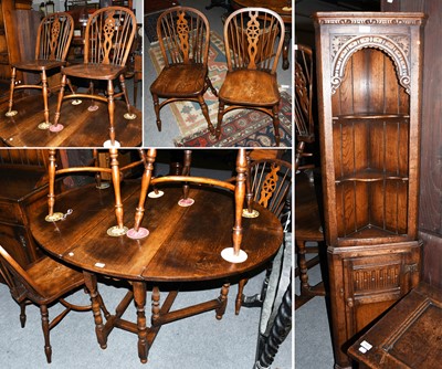 Lot 1297 - A Set of Four Siesta Elm Wheel Back Chairs, an...