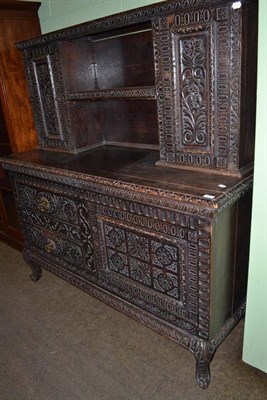 Lot 697 - Carved oak sideboard with superstructure back