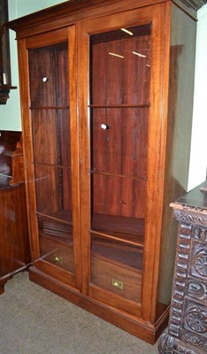 Lot 698 - A glazed mahogany floor standing bookcase