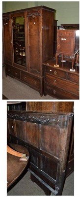 Lot 702 - An early 20th century oak wardrobe and matching dressing chest, carved oak bedstead and similar...