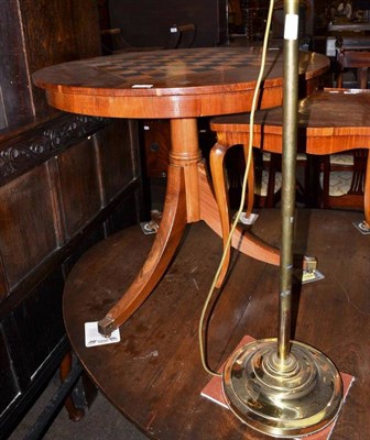 Lot 704 - A brass reading lamp, a reproduction yew games tripod table and an inlaid occasional table (3)