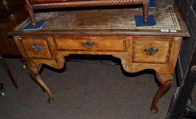 Lot 706 - A reproduction Queen Anne style writing desk with leather top and cabriole legs