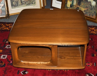 Lot 1333 - An Ercol Elm Coffee Table, fitted with drawers...