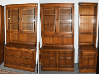 Lot 1229 - A Set of Three Ercol Elm Bookcases, the two...