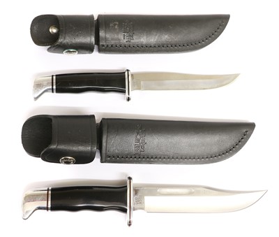 Lot 326 - Two Buck Hunting Knives, each with black...