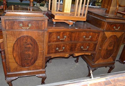 Lot 728 - A mahogany pedestal sideboard with brass handles and carved moulding