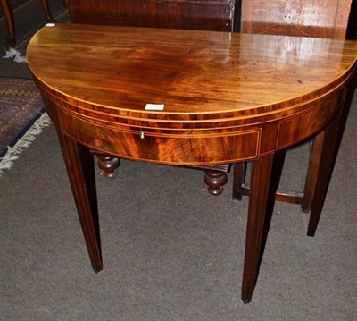 Lot 731 - A 19th century mahogany demi-lune tea table