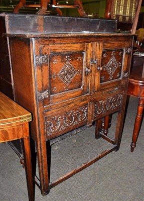 Lot 732 - An 17th century style reproduction carved oak cabinet, possibly Titchmarsh & Goodwin