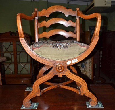 Lot 734 - Walnut cross framed armchair with beadwork seat