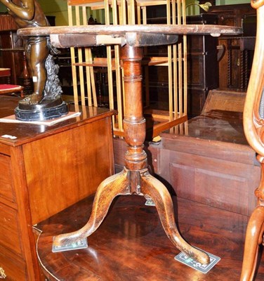 Lot 737 - A George III oak tripod table